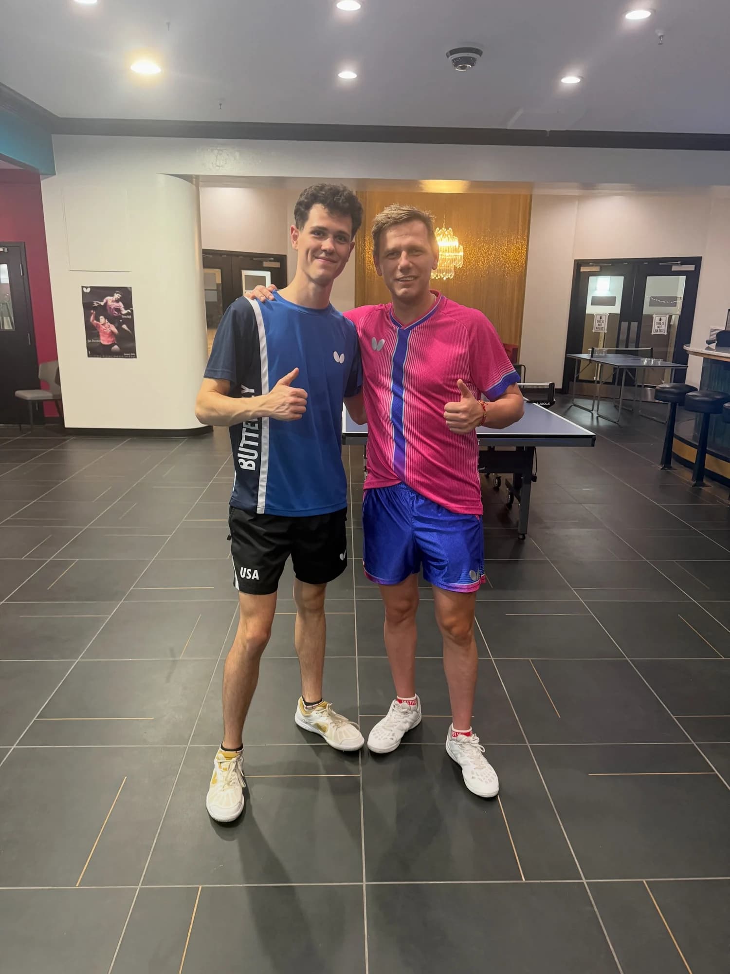 Two players in match kit at the club after a coaching clinic